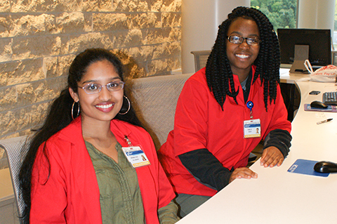 Volunteers smiling at the camera