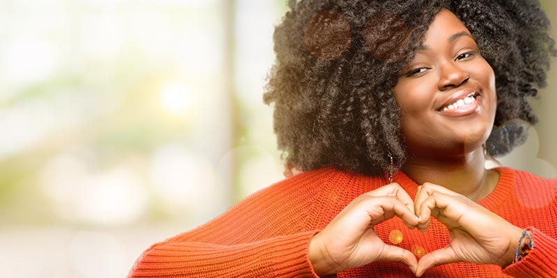woman making heart gesture