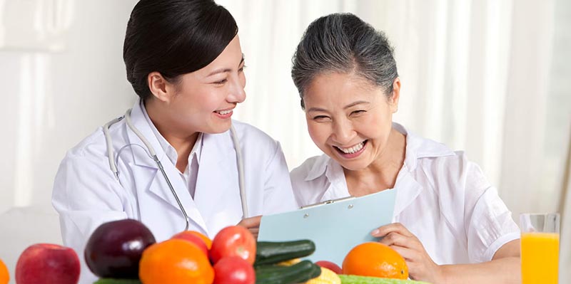 Woman and dietitian with food